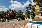 Wat Xieng Thong temple in Luang Prabang, Laos. View of the sim with a 'that' in the foreground. 